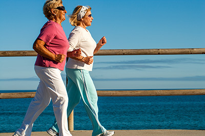 Two elderly jogging/exercising